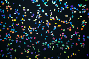 colorful stars on a black background