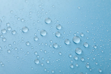 Fototapeta na wymiar Many water drops on blue background. Texture background.