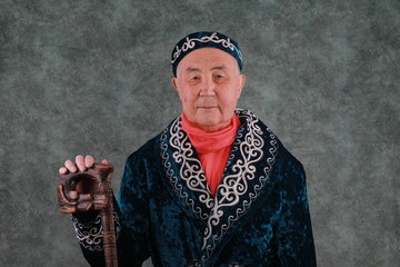 portrait of an old kazakh in national kazakh clothes