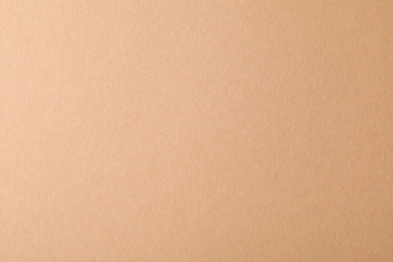 Beige textured sheet background. Empty space for text