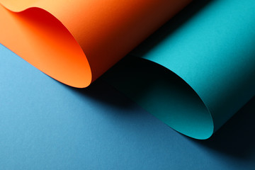 Color sheets on blue background, close up. Abstract background