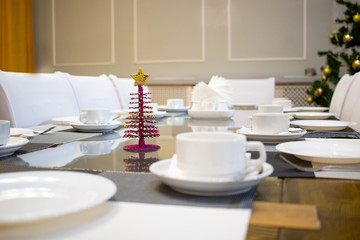 served table in a restaurant with cups and appliances