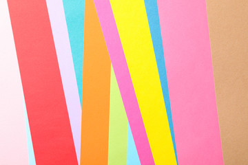 Multicolored background made of sheets, top view. Abstract background