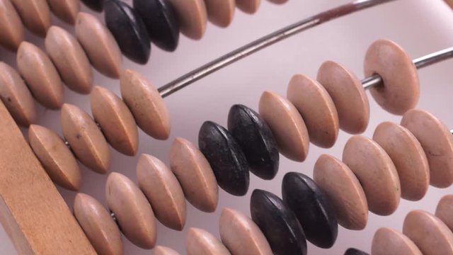 Vintage wooden abacus. Camera move over objects. Close-up. Close-up