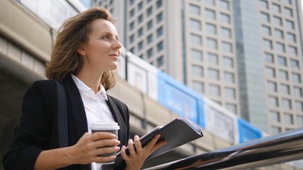 Fototapeta na wymiar Business Woman With Tablet On City Background