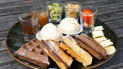 Plate Of Belgian Waffles With Ice Cream And Fruits