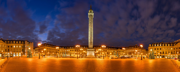Panoramic view of Place Vendome with Christmas holiday decorations at dusk. In the center, the statue of Napoleon on top of the Vendome column. 1st Arrondissement, Paris, France - obrazy, fototapety, plakaty