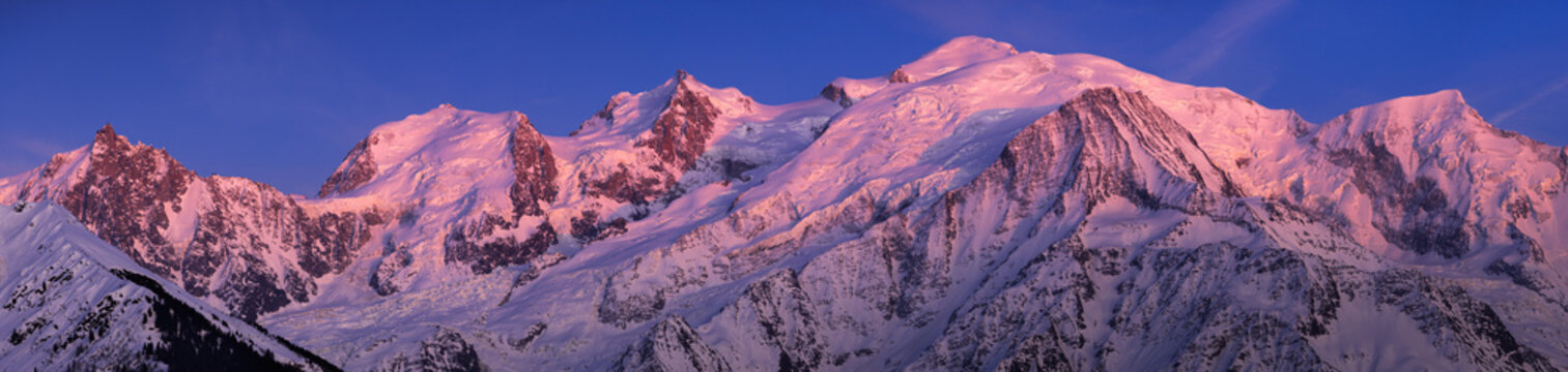 Mont Blanc Massif at twilight. Panoramic view includes Aiguille du Midi, Mont Blanc du Tacul, Mont Maudit, Dome du Gouter, Bossons and Taconnaz Glacier. Haute-Savoie (74), European Alps, France