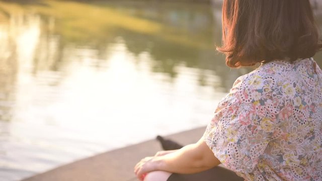 Slow motion,Asian woman sitting alone and depressed,stop abusing domestic violence, health anxiety.
