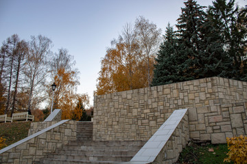 A flight of stairs in the park area in the autumn evening