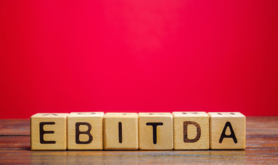 Wooden blocks with the word Ebitda. Earnings before interest, taxes, depreciation and amortization. Financial result of the company. Cash flow estimate. Financial performance ratio. Pretax profit.
