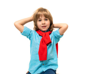 Sports teenager boy in t-shirt with hoody around his neck gesticulates isolated on blue background