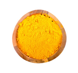 turmeric powder in wooden bowl on white background