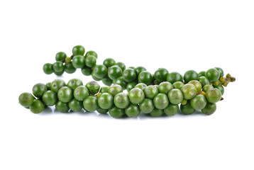 green peppercorns on white background