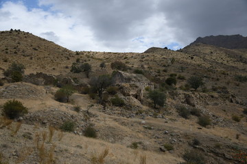 ruined medieval church in Armenia. ruined medieval university. Ancient  university and castle. medieval university on a mountain landscape. medieval university on a background of cloudy sky.