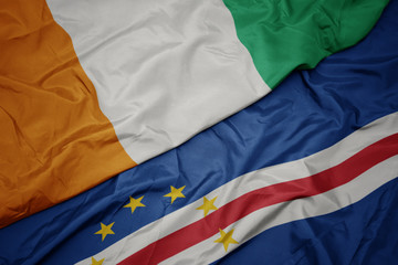 waving colorful flag of cape verde and national flag of cote divoire.
