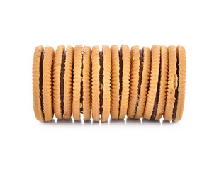 Sandwich cookie filled with chocolate cream on white