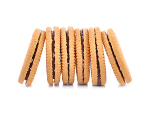Sandwich cookie filled with chocolate cream on white