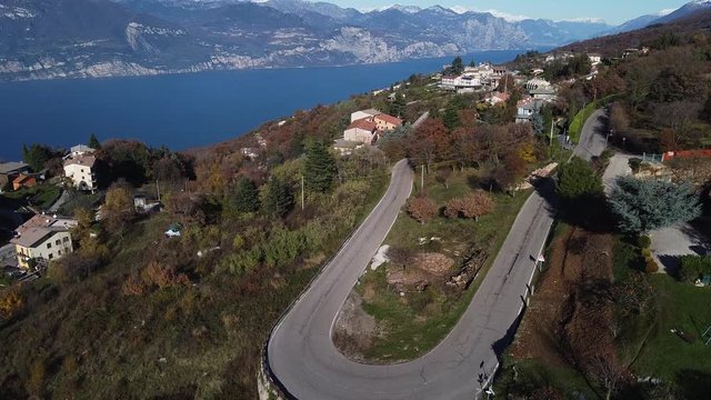 Coastal aerial panorama of Lake Garda in autumn. Close to San Zeno di Montagna and Monte Baldo clear view up to Riva.