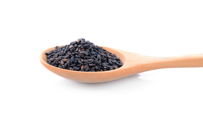 Black Sesame Seeds in wooden spoon isolated on white background