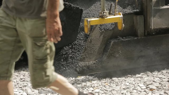 Tracked Pavers Laying Asphalt