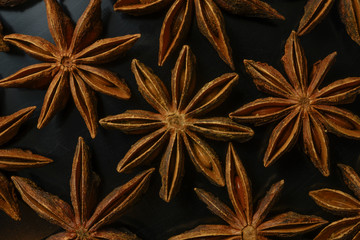star anise on black background closeup