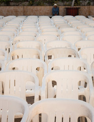 Ixtapan de la Sal, Mexico - Dic 2013 The Monobloc chair is a lightweight stackable polypropylene chair, usually white in colour, often described as the world's most common plastic chair.