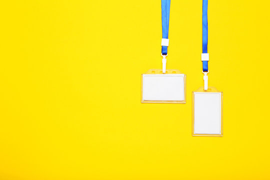 Blank white bagdes on yellow background