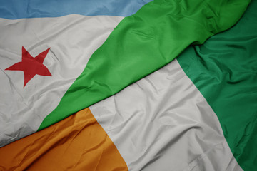 waving colorful flag of cote divoire and national flag of djibouti.