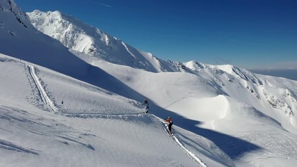 4k aerial footage with ski mountaineers competing during a ski touring and mountaineering race in Fagaras mountains