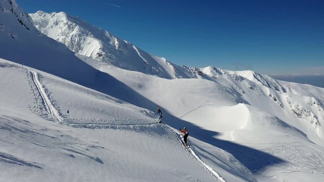 4k aerial footage with ski mountaineers competing during a ski touring and mountaineering race in Fagaras mountains
