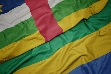 waving colorful flag of gabon and national flag of central african republic.