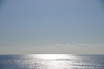 Low horizon over the ocean with reflections from the sun