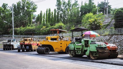 The line of  steamroller, compactor machines / vehicles for industrial pavement, road construction works.