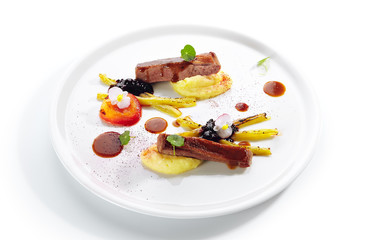 Fried Duck Breast with Baked Plum and Glazed Rhubarb Isolated