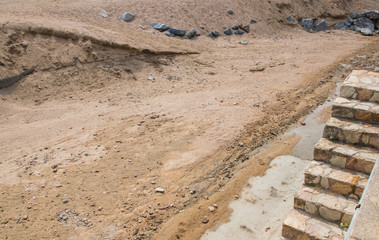 Sand and stones on the building.