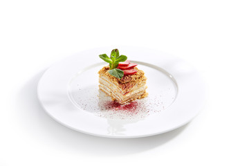 Traditional Russian Honey Cake Medovik on Restaurant Plate Isolated