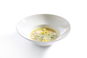 Chicken Bouillon with Tortellini Pasta in White Restaurant Bowl