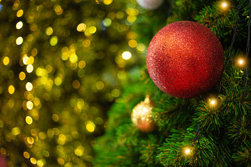 Christmas tree balls in a Christmas jumper with lights