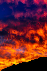 Silhouetted hillside at Sunset, sunrise