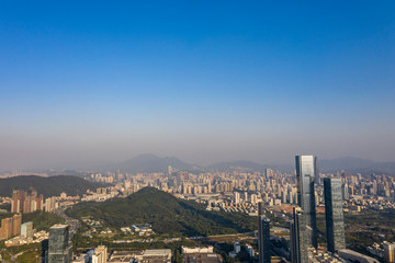 an aerial view of downtown districts in shenzhen, china under the blue sky