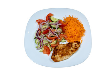 plate of grilled chicken with vegetables isolated on wite background, top view