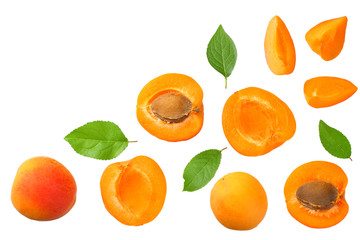 apricot fruits with slices and green leaf isolated on white background. top view