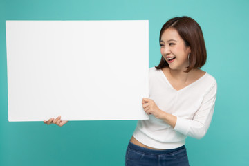 Young attractive asian woman showing and holding blank white board, Showing empty board for input...