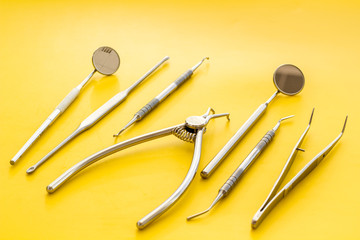 Dental instruments - set with mirrors - on yellow background close up