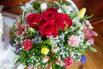Red flower picture close up in the bouquet. The flower's petal . Bouquet of fresh red, white , orange roses . bouquet of multicolored roses .