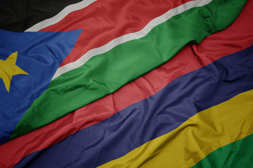 waving colorful flag of mauritius and national flag of south sudan.