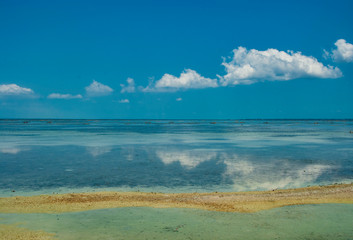 Fototapeta na wymiar Clouds reflected in the water at the islands close to Jaffna Sri Lanka