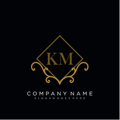 Initial letter KM logo luxury vector mark, gold color elegant classical