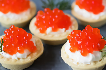 Tartlets with red caviar.